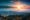 A photograph of Portland downtown with rolling fog and autumn foliage in shining sunrise and colorful clouds