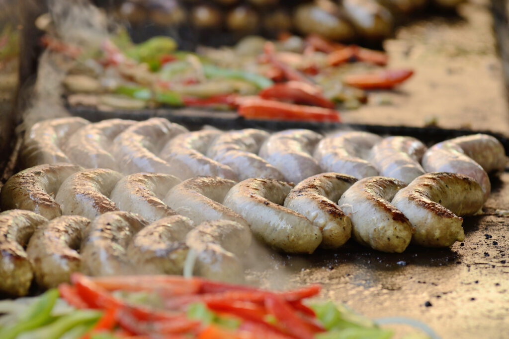Cooking vegetables and sausages at a food truck in Portland Oregon
