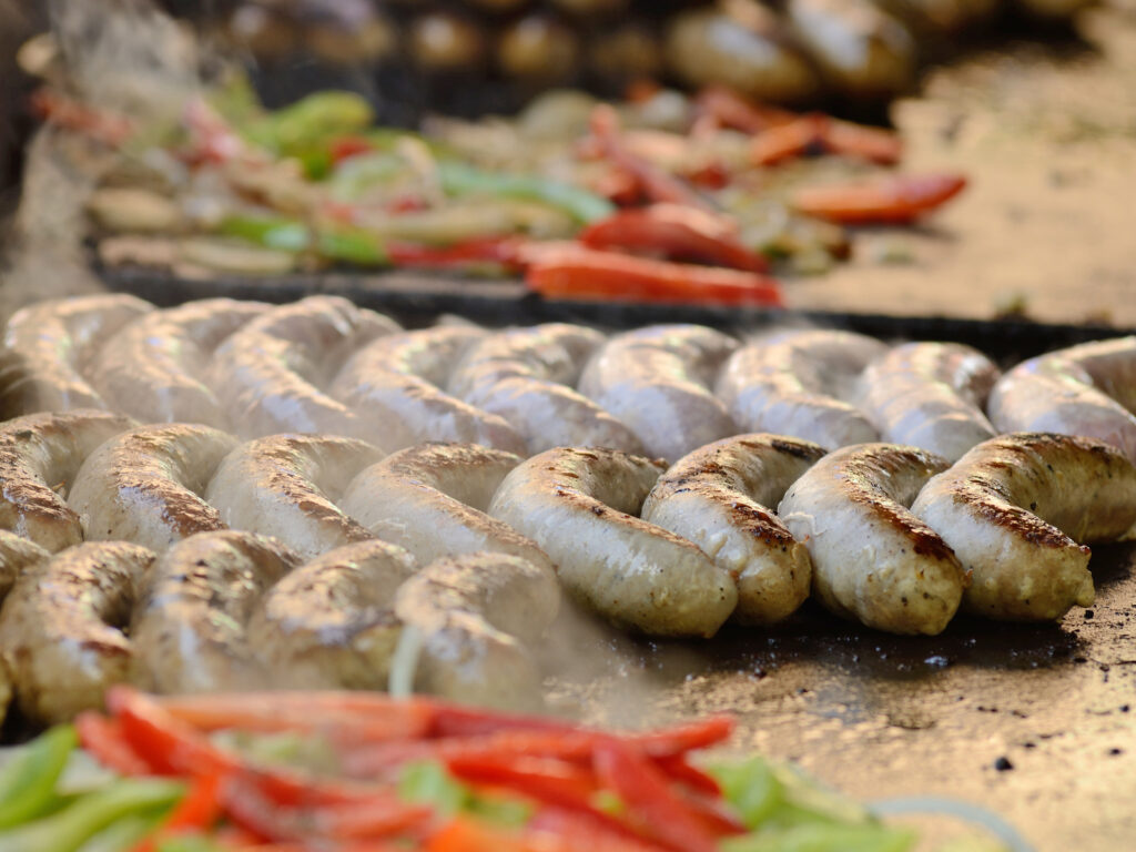 Cooking vegetables and sausages at a food truck in Portland Oregon