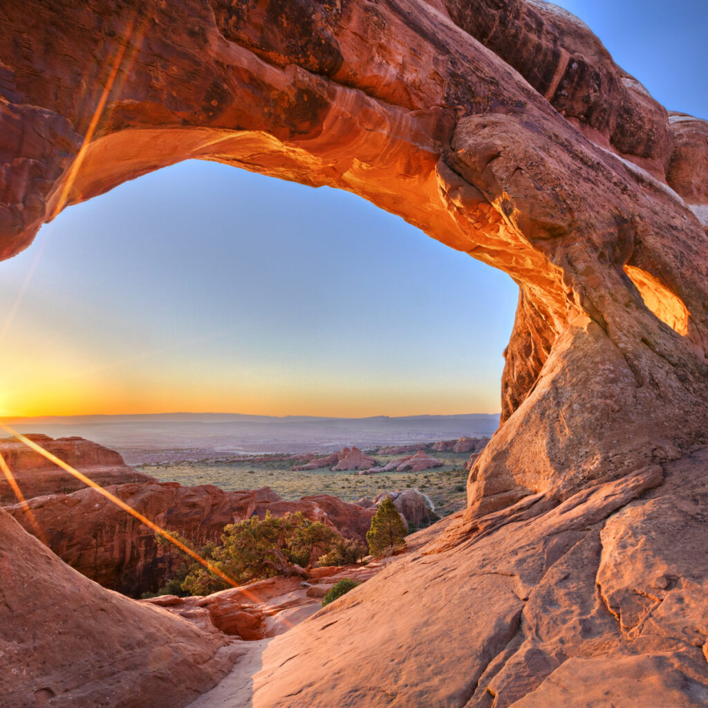 Sunrise at Partition Arch, in Arches National Park.