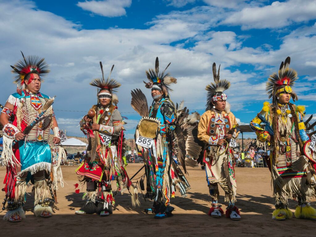 Navajos dancers wearing ceremonial clothes