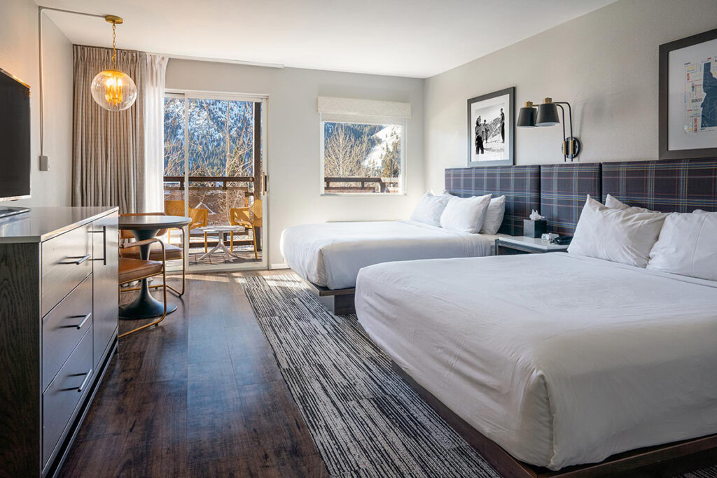 Guest room with two queen beds and balcony
