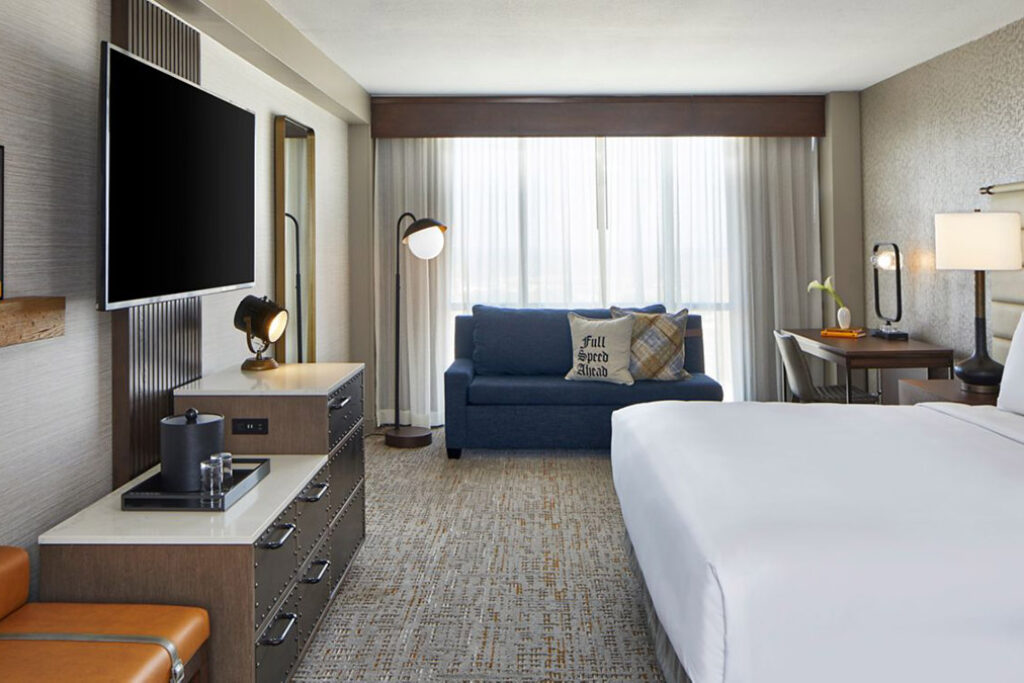 King guest room with sofa and tv