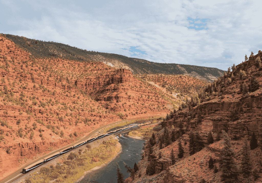 Exterior of Rocky Mountaineer train near Red Canyon along the Rockies to the Red Rocks route.