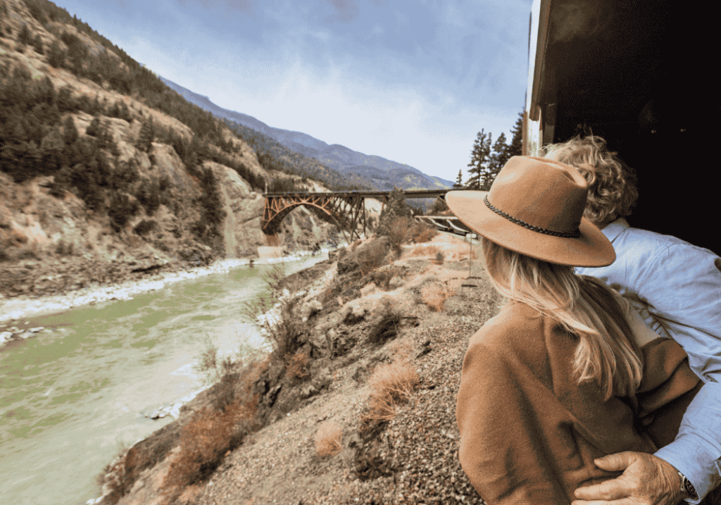 Couple in GoldLeaf outdoor viewing platform looking at scenery