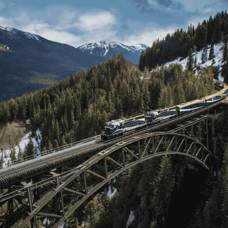 Rocky Mountaineer travelling across Stoney Creek Bridge on the First Passage to the West Route