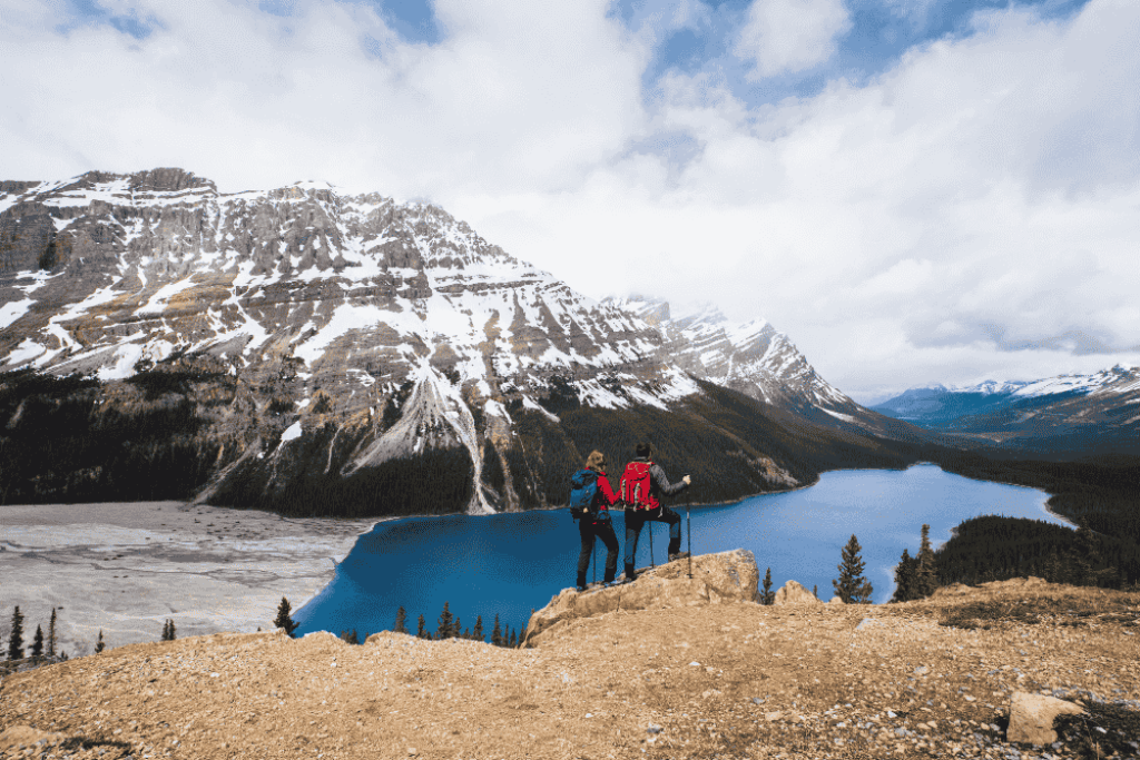 Young couple in Peyto lake, Banff National Park in Canada
