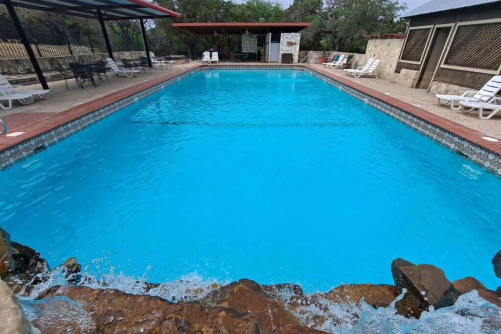 Outdoor swimming pool at Mayan Dude Ranch in Bandera, Texas