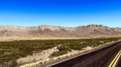 Clear blue skies, plateaus, and endless road meet in West Texas near Van Horn.