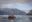 Small zodiac boat cruising through Alaskan waters