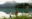 Two friends walking along the shores of Emerald Lake in Yoho National Park in the Canadian Rockies, with Emerald Lake Lodge in the background.