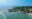 Maine rocky coast with crashing waves and aerial view of marginal way running and walking path.