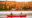 People canoeing on a lake in Maine in the fall