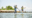 Two people paddleboarding in Maine