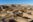 Chaco Culture National Historical Park in New Mexico. Pueblo del Arroyo great house, kivas, and woman in blanket. Chaco Canyon was a major Ancestral Puebloan culture center and has many pueblos.